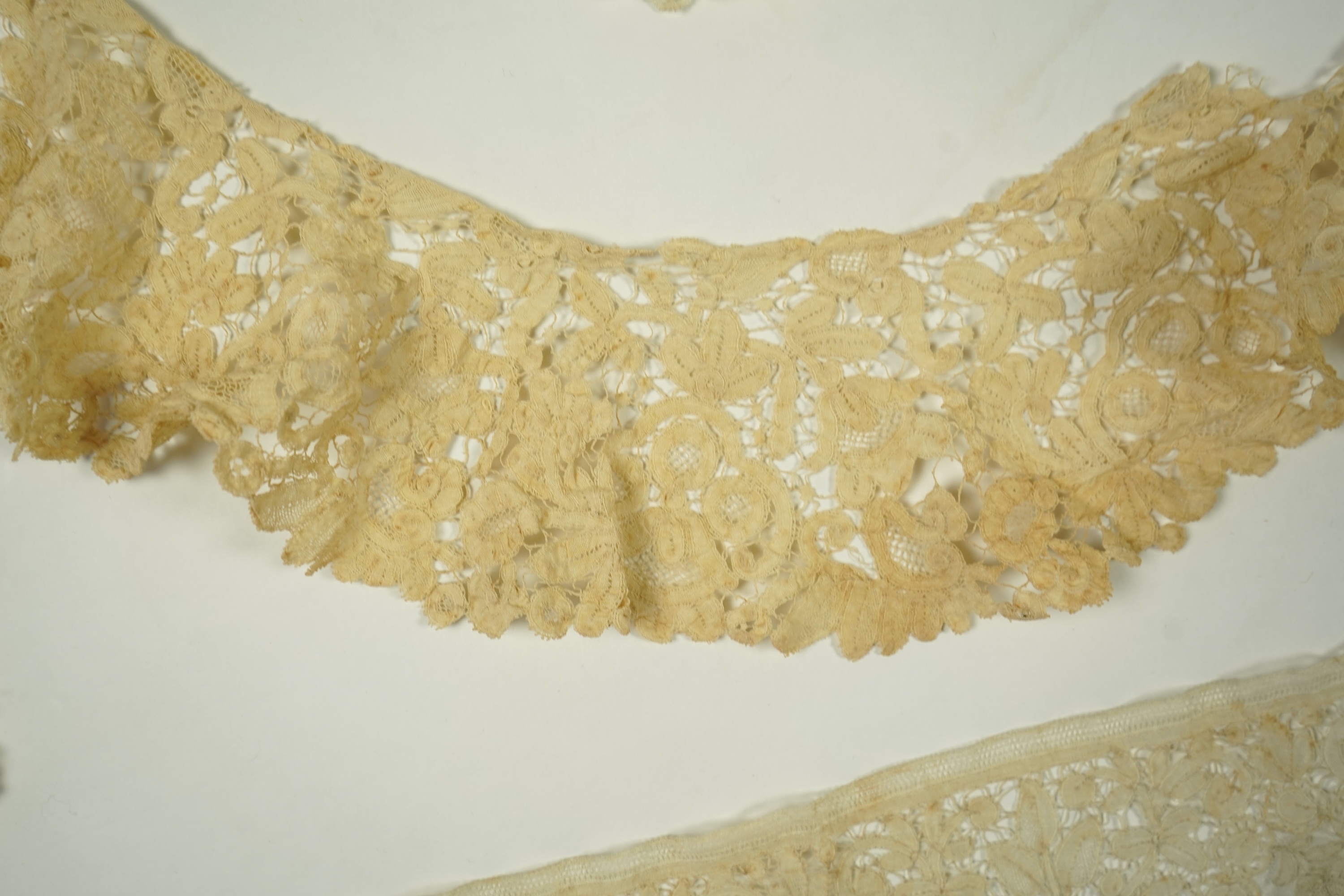 A mixed Brussels bobbin lace and Point de Gaze lace collar, another smaller collar, a similar length of trim and butterfly motif, together with a Brussels bobbin collar and trim, an Irish crochet cuffs, a Valenciennes la